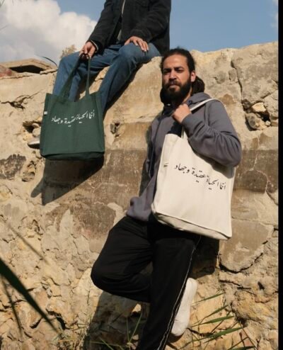 إنما الحياة عقيدة و جهاد- large oill green tote bag